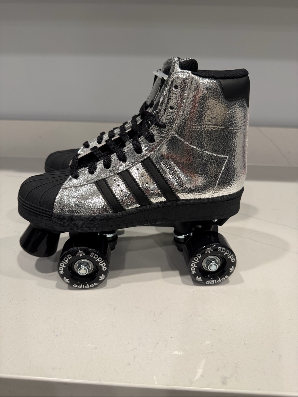 NWT Adidas Originals Superstar 82 Roller Skates in a metallic silver M-6.5 W-8